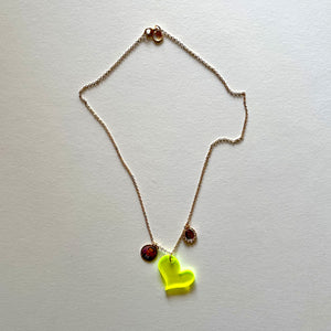The yellow heart and saints necklace