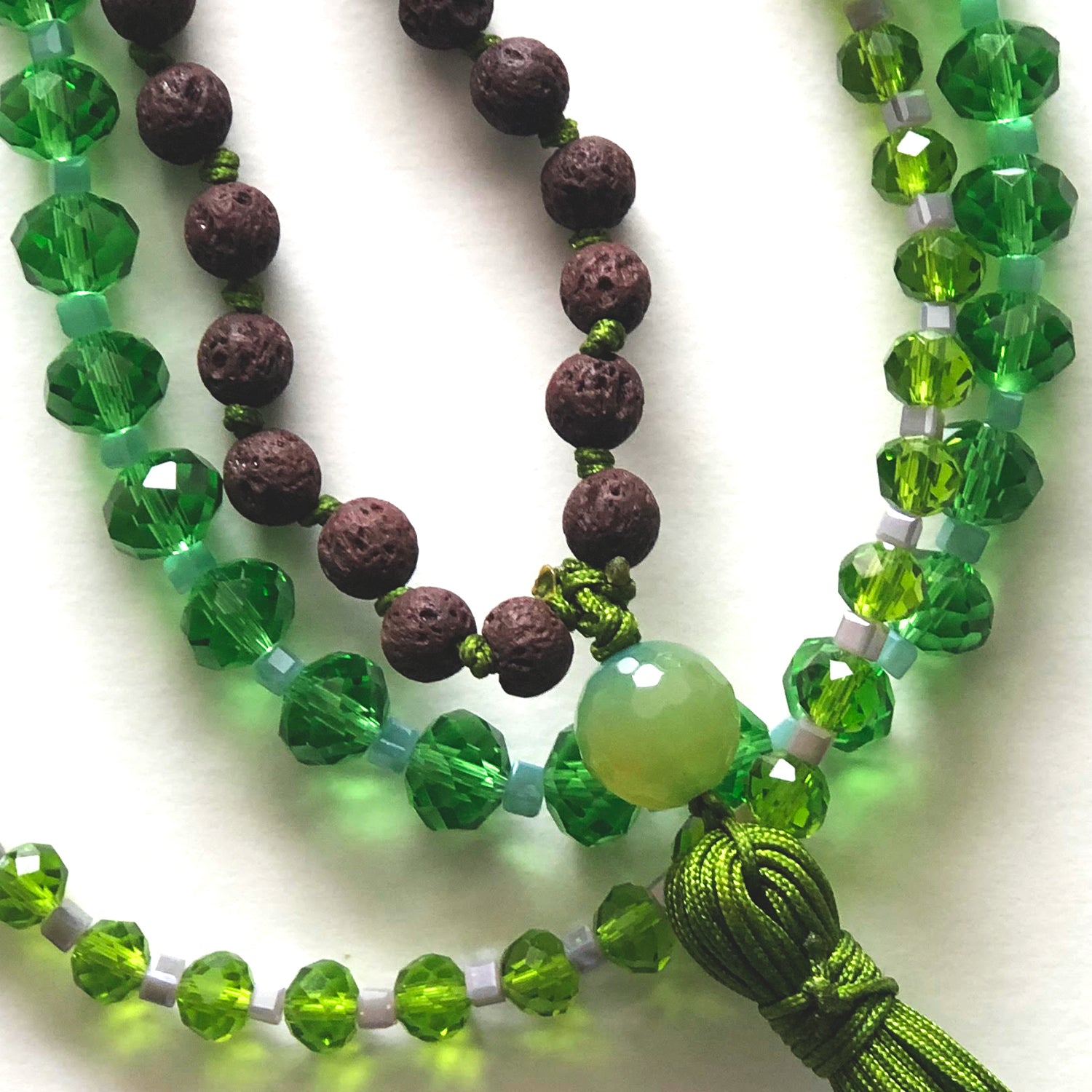 Brown japamala and green crystal necklaces