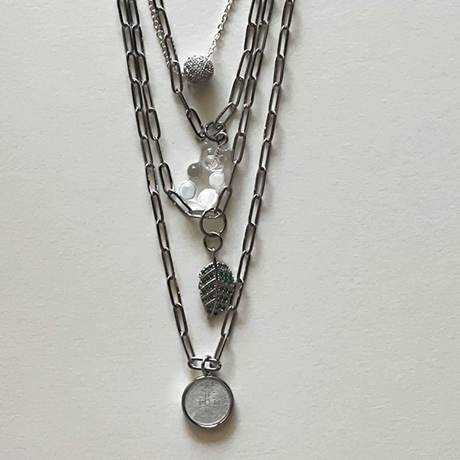 Saint Benedict and silver necklace