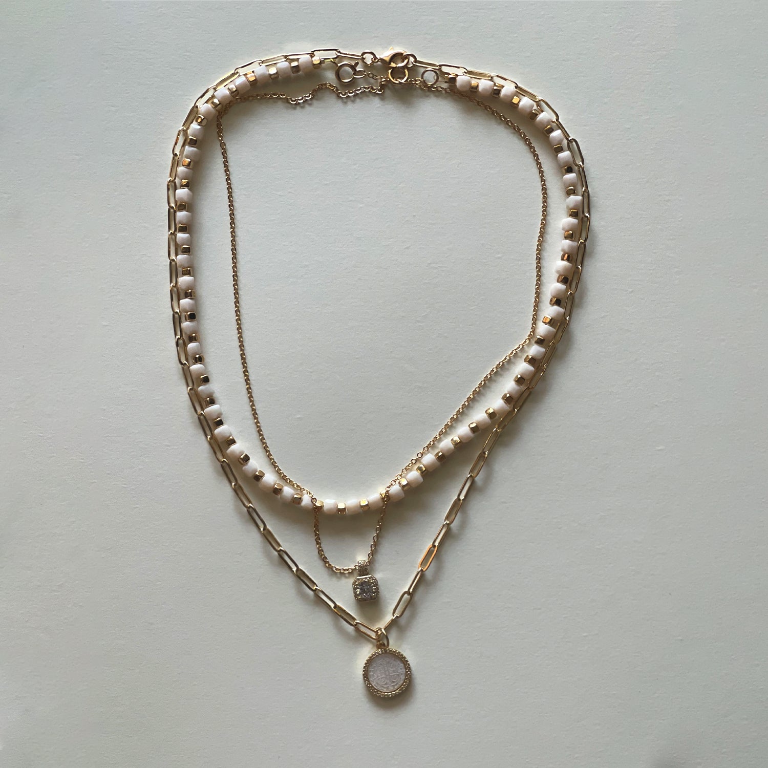 The white Saint Benedict and white necklace