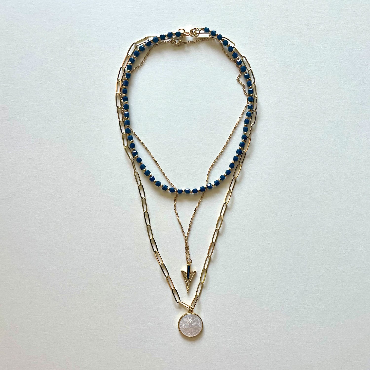 The Saint Benito and blue necklace