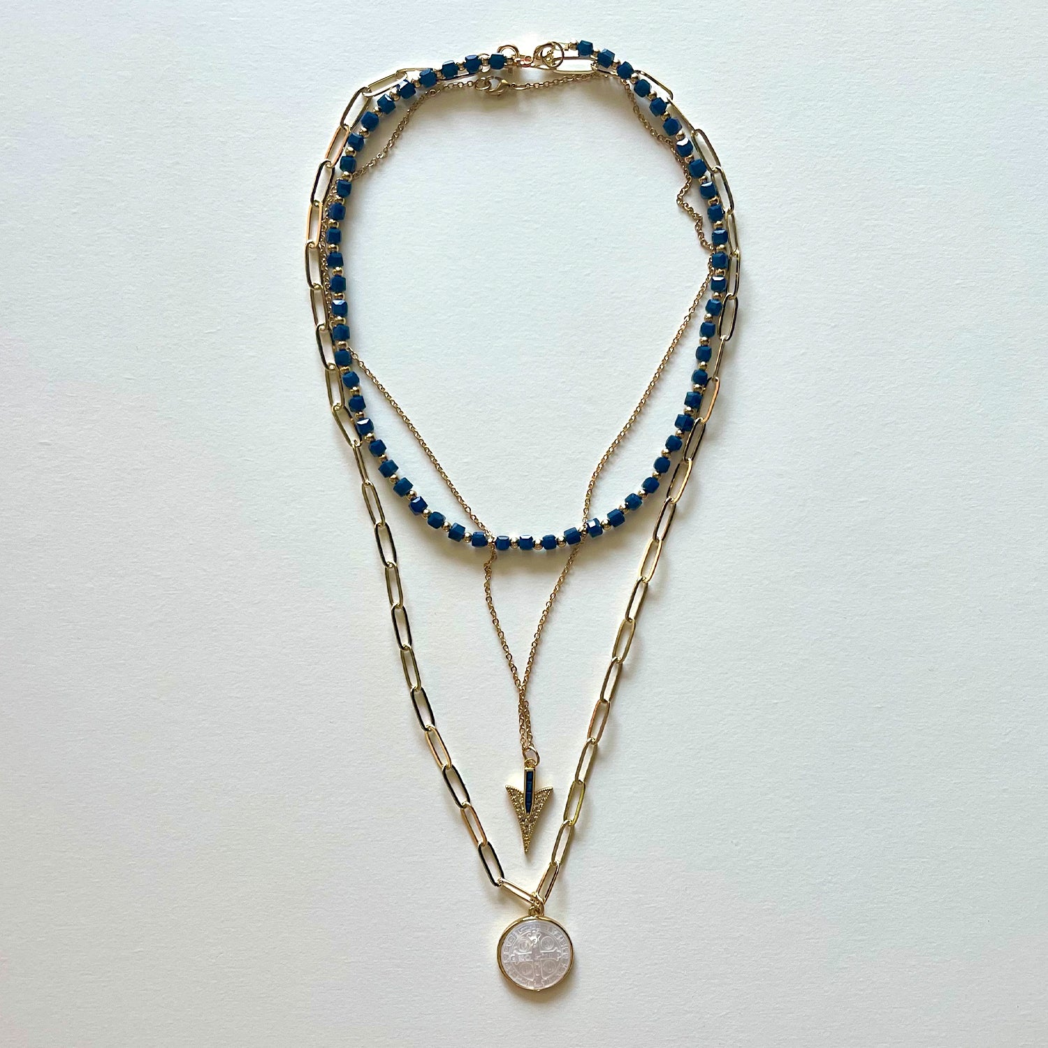 The Saint Benito and blue necklace