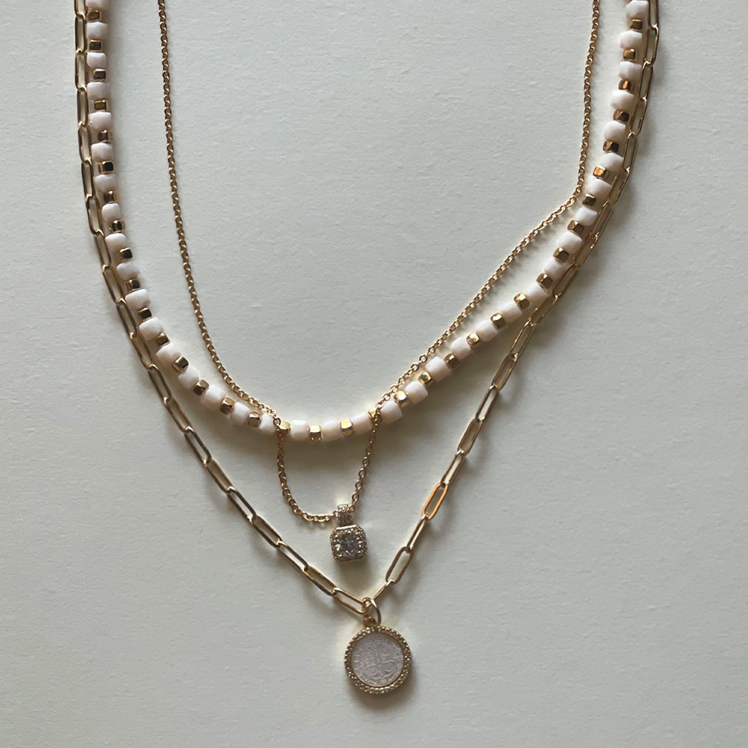 The white Saint Benedict and white necklace