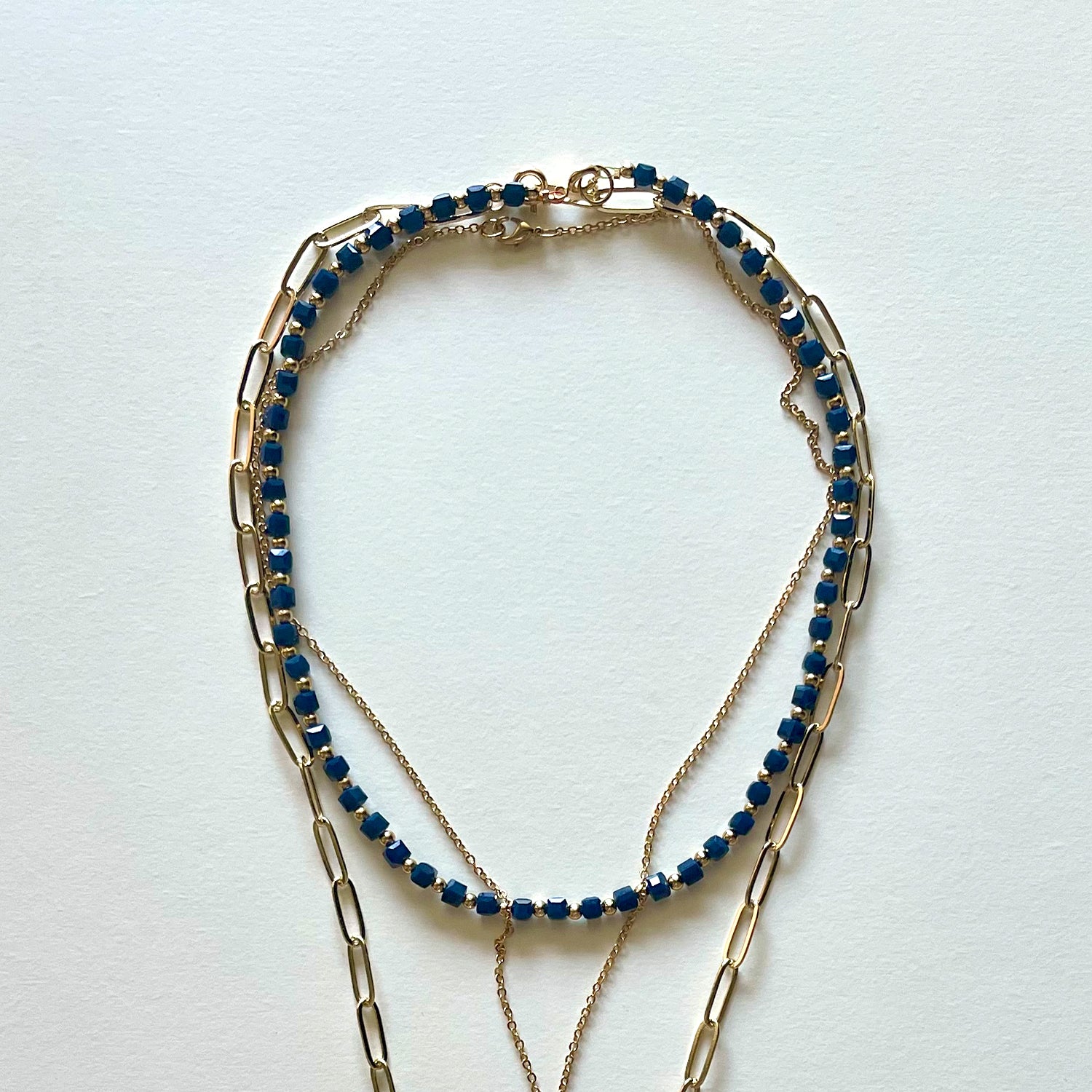 The Saint Benito and blue necklace