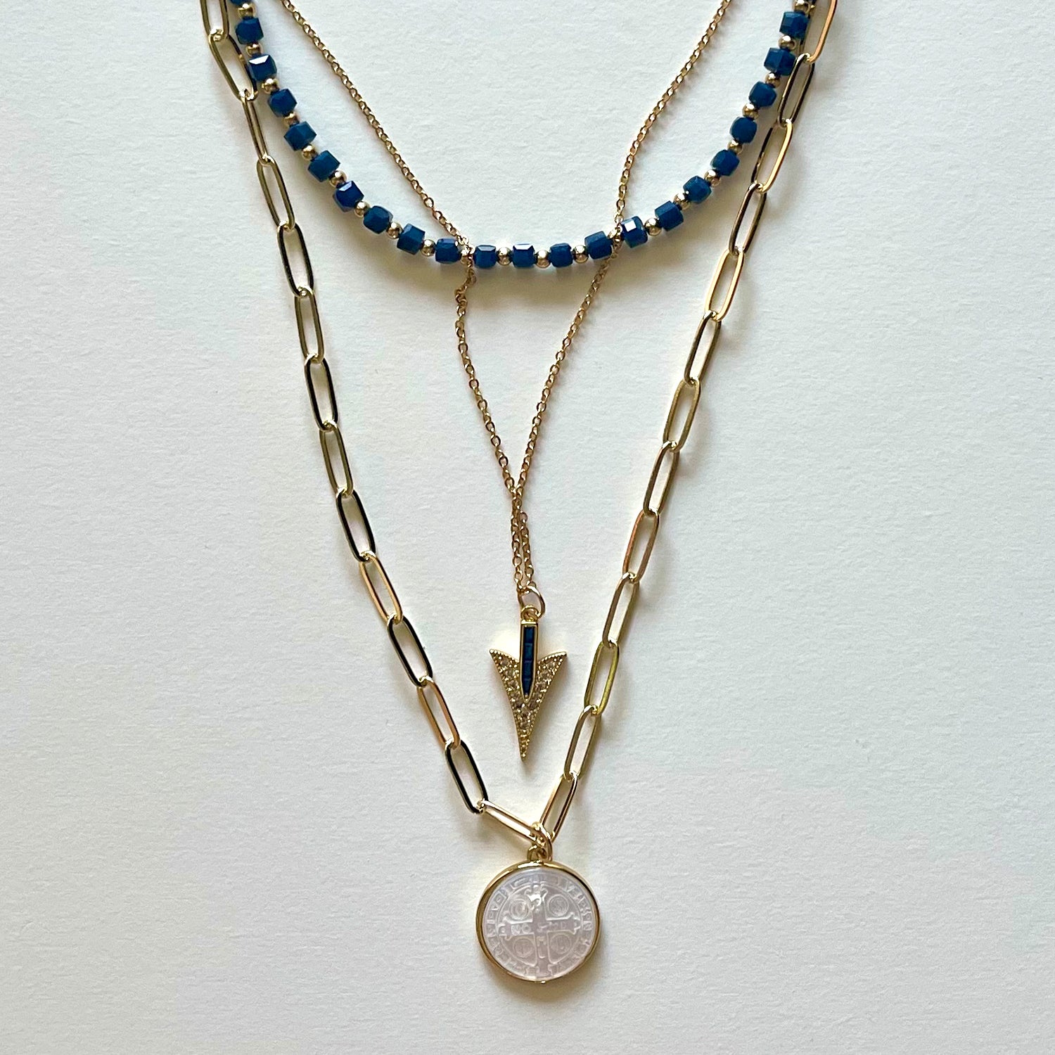The Saint Benito and blue necklace