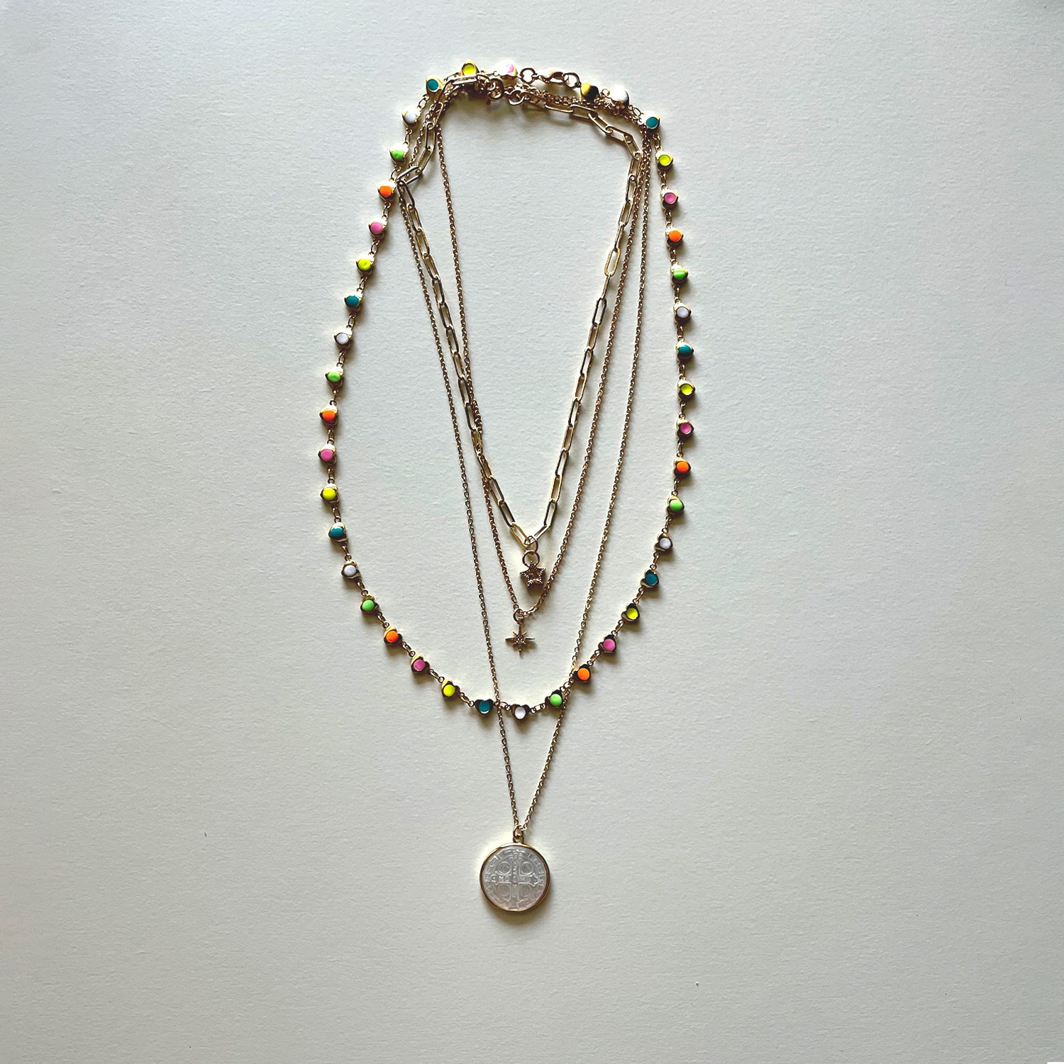 The white Saint Benedict and hearts necklaces