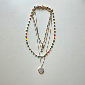 The white Saint Benedict and hearts necklaces