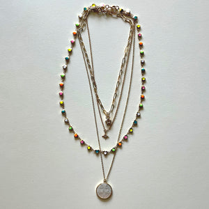 The white Saint Benedict and hearts necklaces