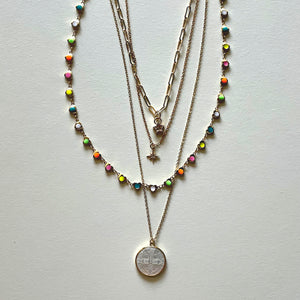 The white Saint Benedict and hearts necklaces