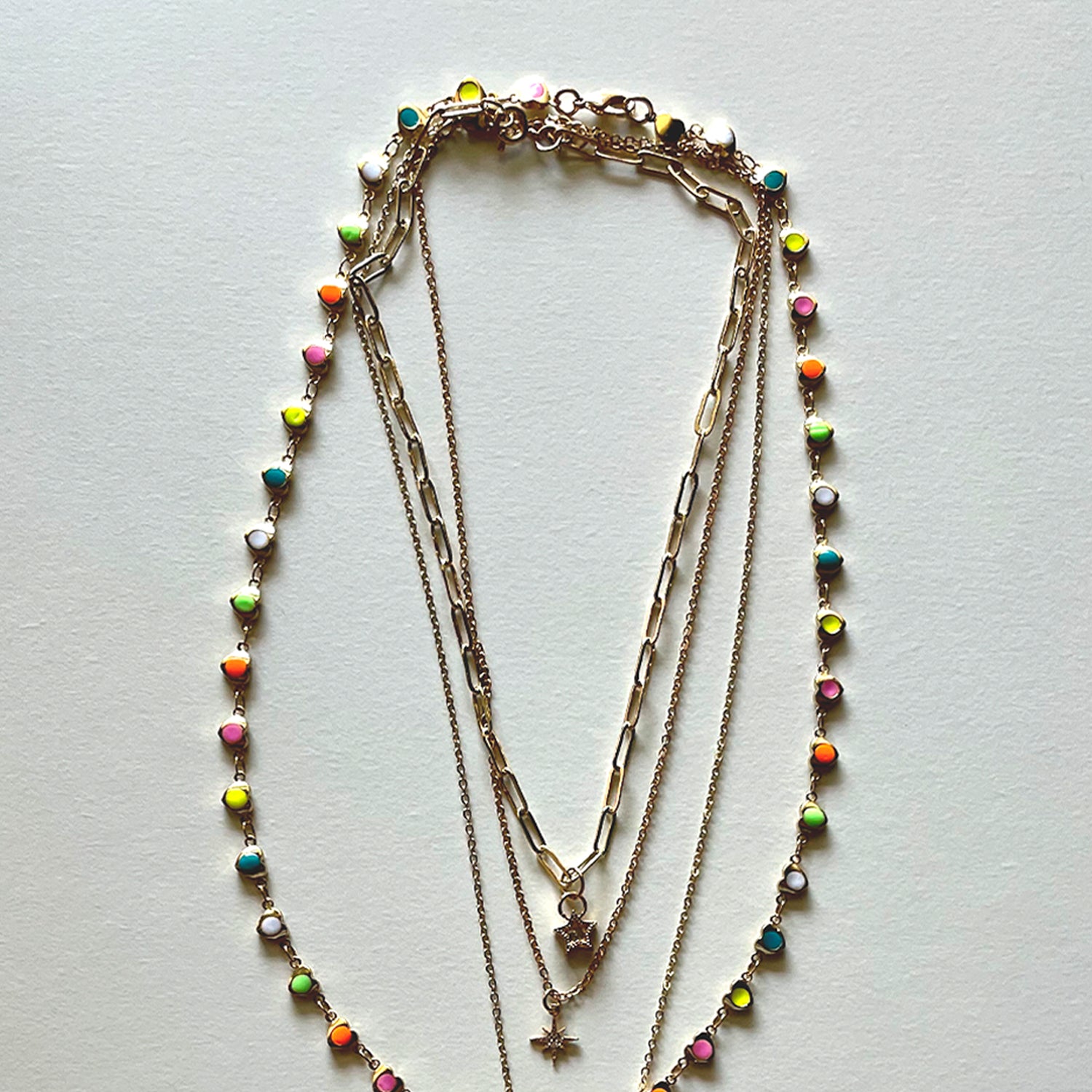 The white Saint Benedict and hearts necklaces