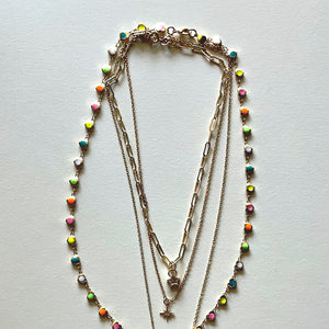 The white Saint Benedict and hearts necklaces