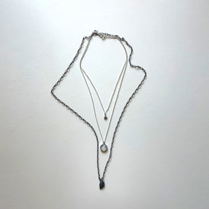 The Virgen del Valle and black necklace