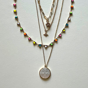 The white Saint Benedict and hearts necklaces
