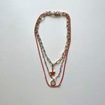 Load image into Gallery viewer, The white Saint Benedict and pink star necklaces
