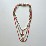 Load image into Gallery viewer, The white Saint Benedict and pink star necklaces
