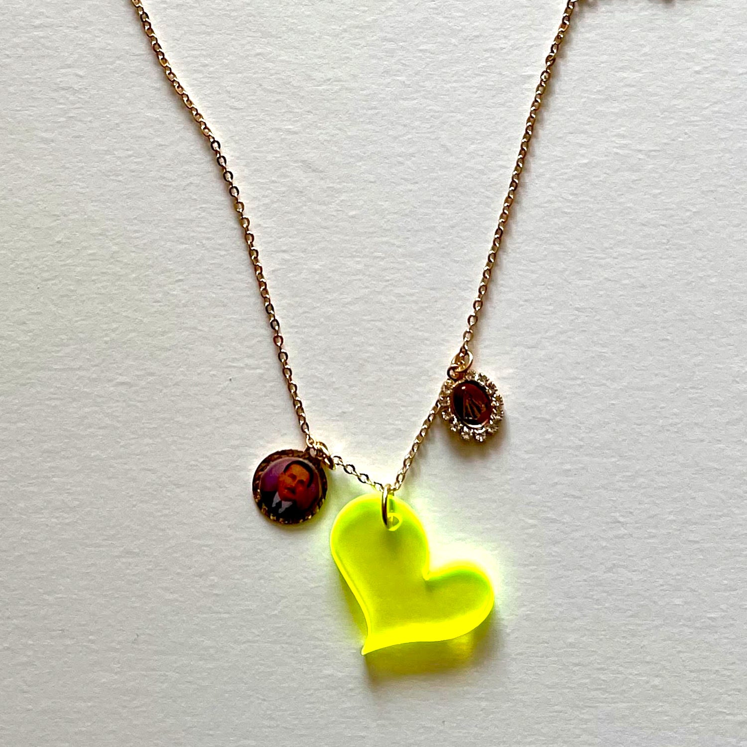 The yellow heart and saints necklace