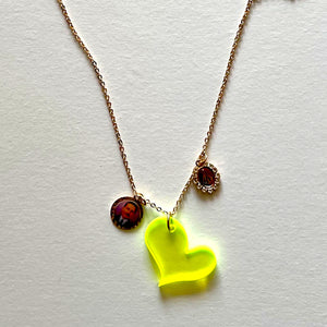 The yellow heart and saints necklace