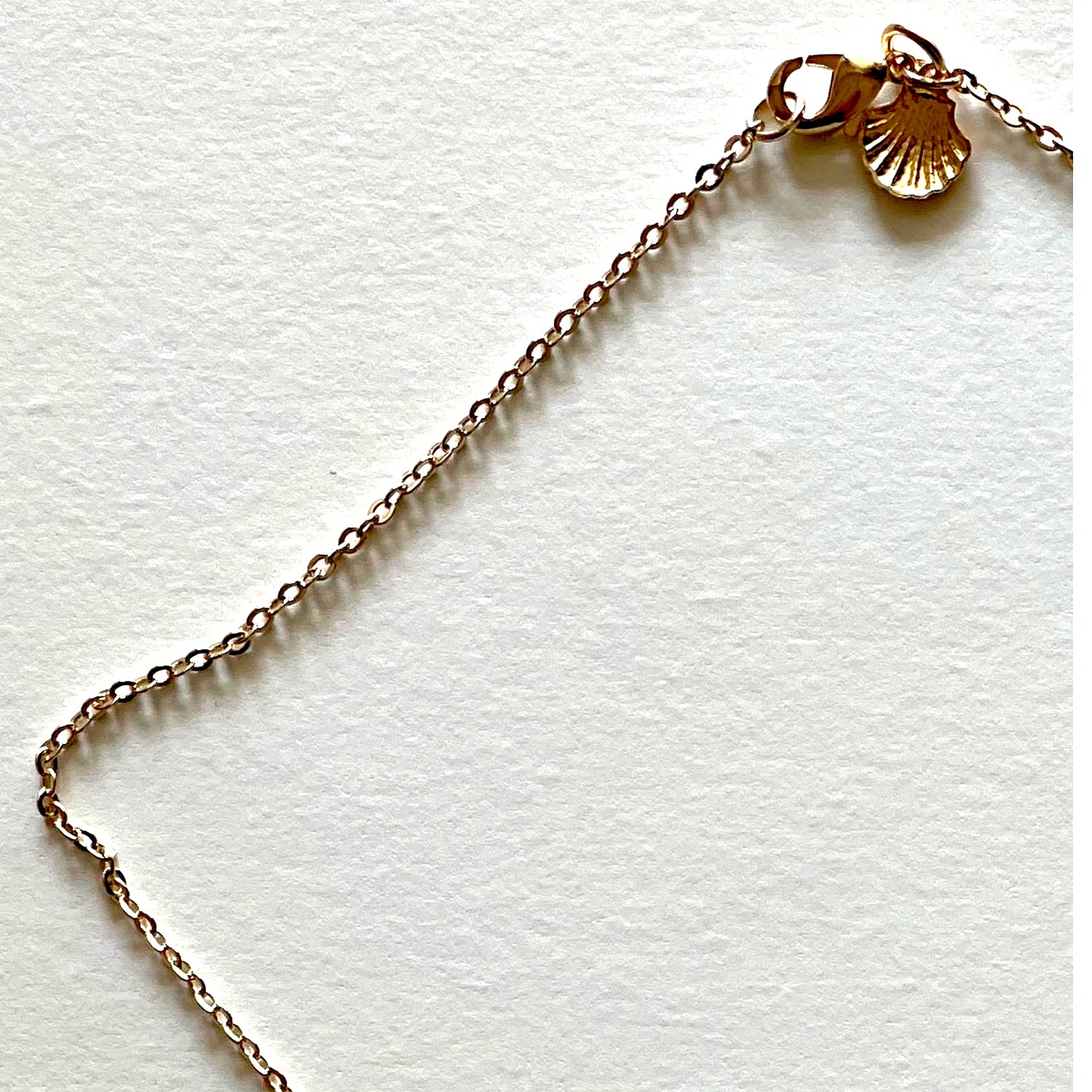 The yellow heart and saints necklace