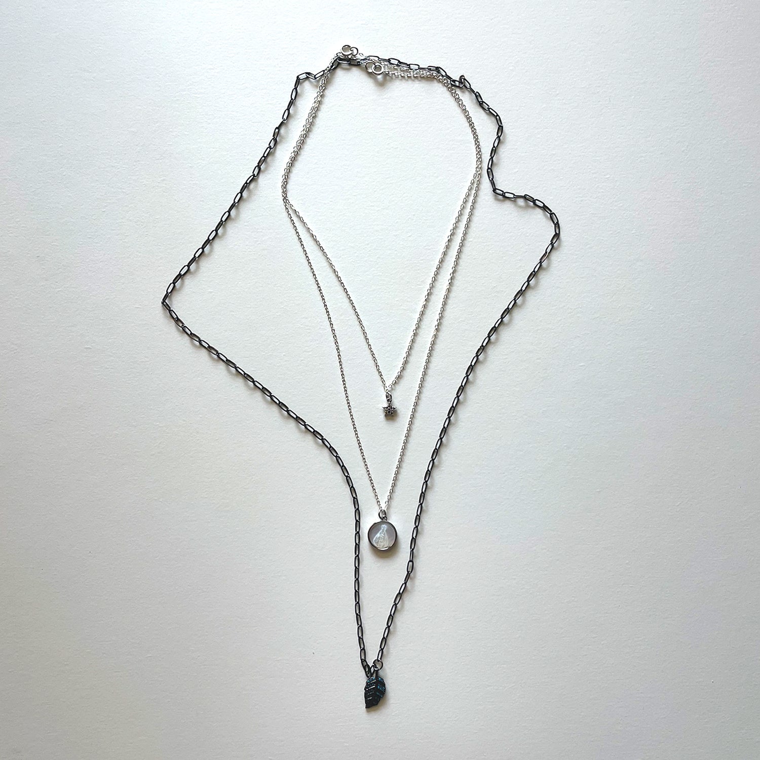 The Virgen del Valle and black necklace