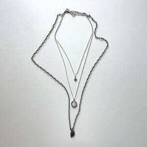 The Virgen del Valle and black necklace