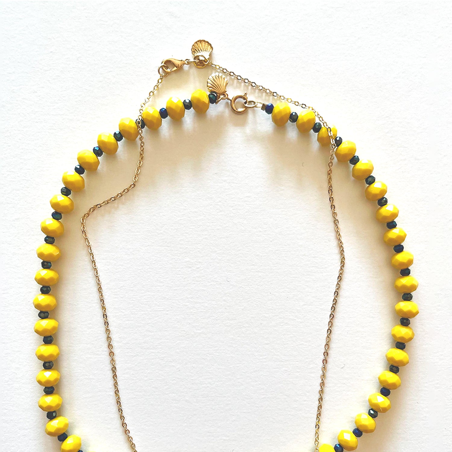 Set aus gelber Kristall- und Schutzkette
