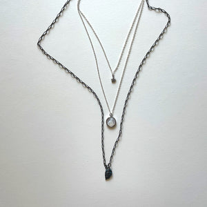 The Virgen del Valle and black necklace