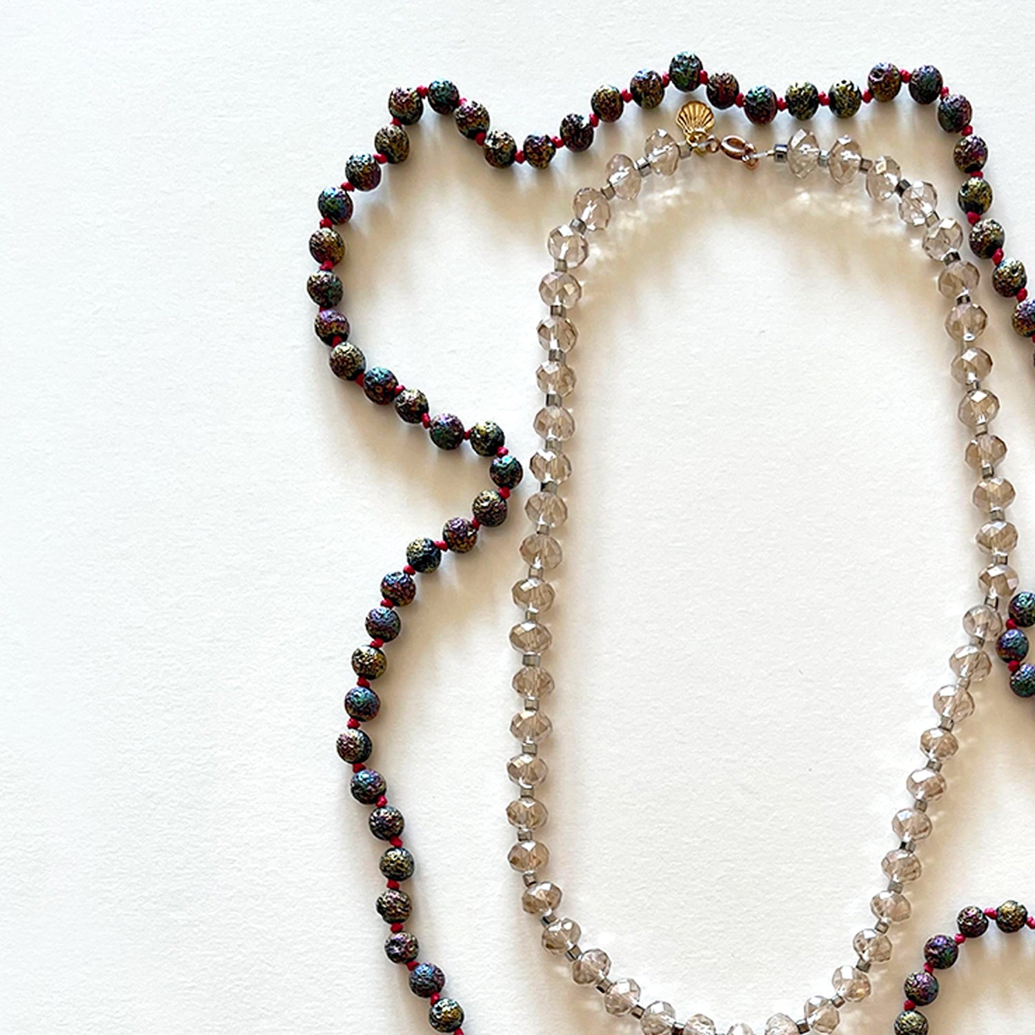 The metallic japamala and the crystal necklace