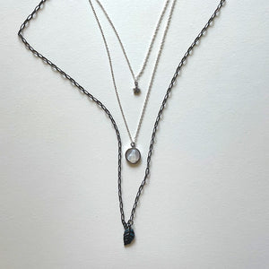 The Virgen del Valle and black necklace