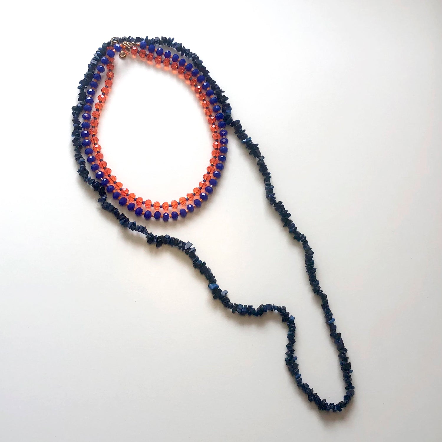 Set of orange and blue crystal necklaces