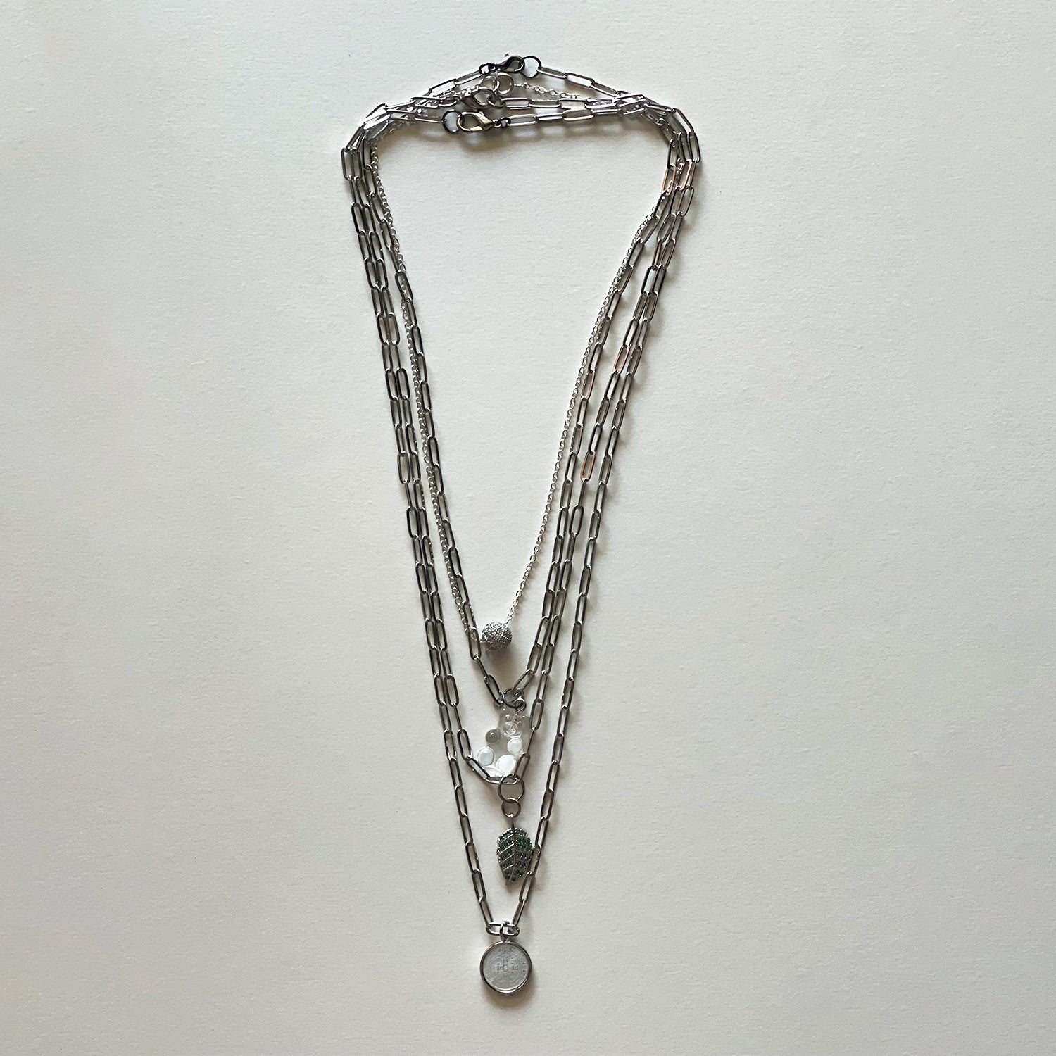 Saint Benedict and silver necklace