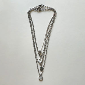 Saint Benedict and silver necklace