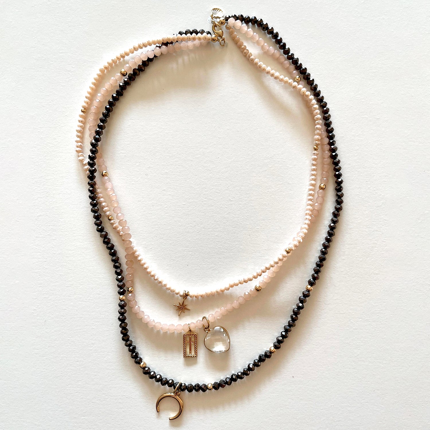 The pink and black necklace