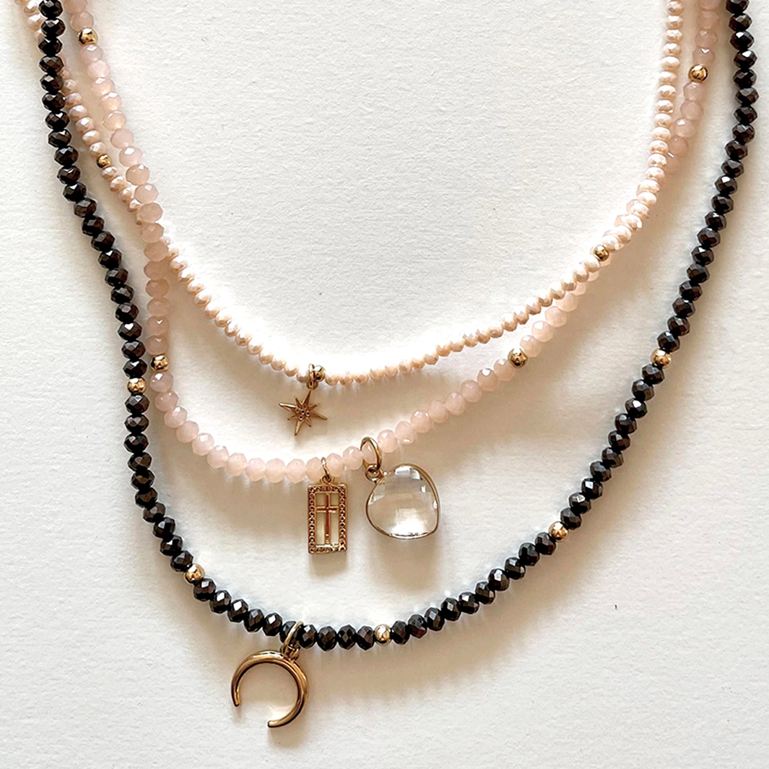 The pink and black necklace