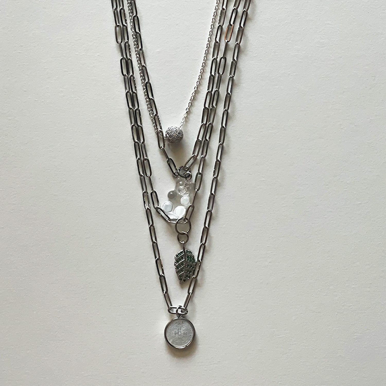 Saint Benedict and silver necklace