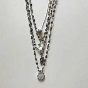 Saint Benedict and silver necklace