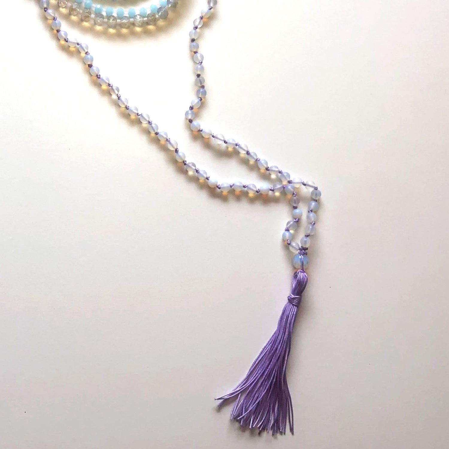 Violet Japamala and blue and white crystal necklace