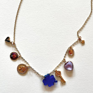 The blue clover and many lucky charms necklace