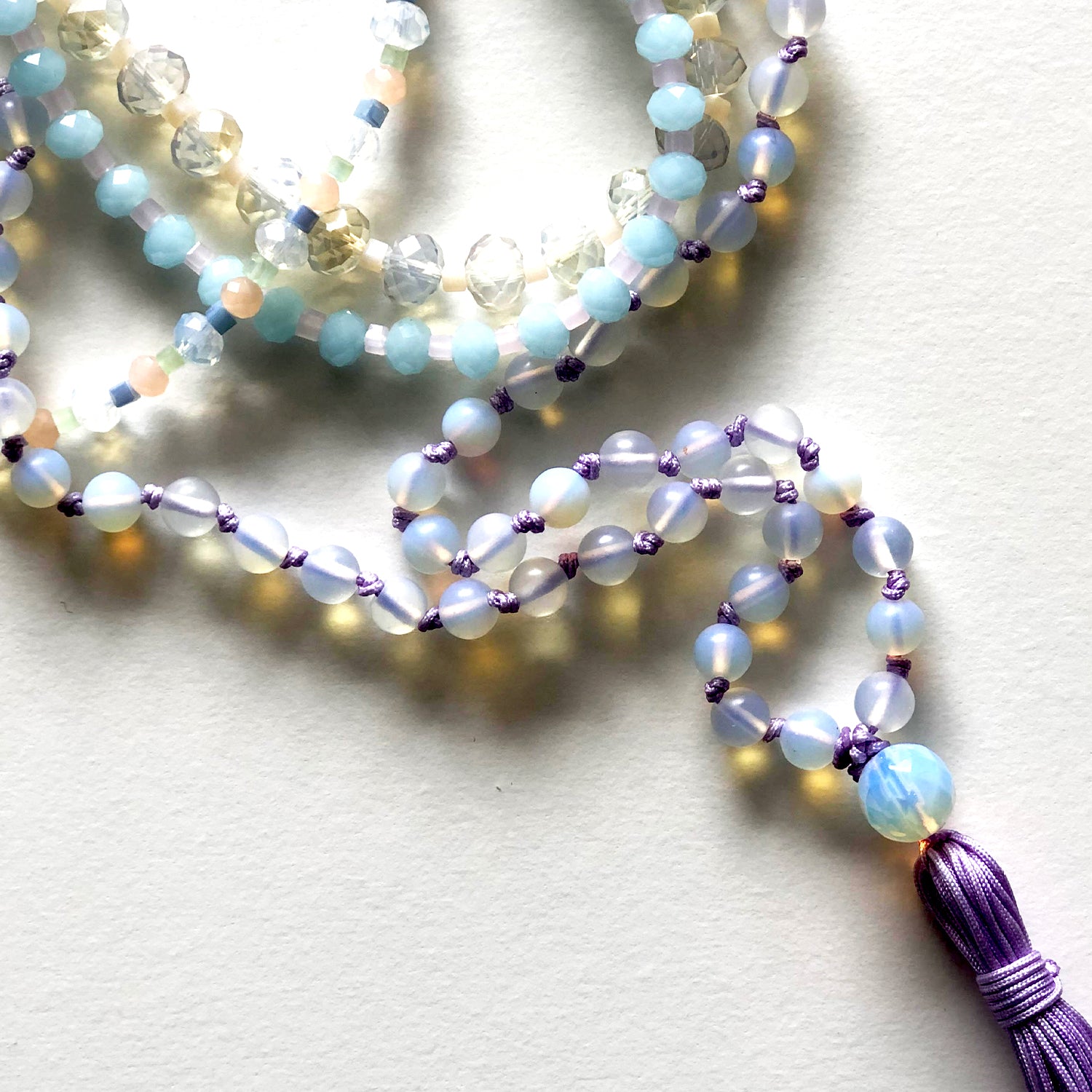 Violet Japamala and blue and white crystal necklace