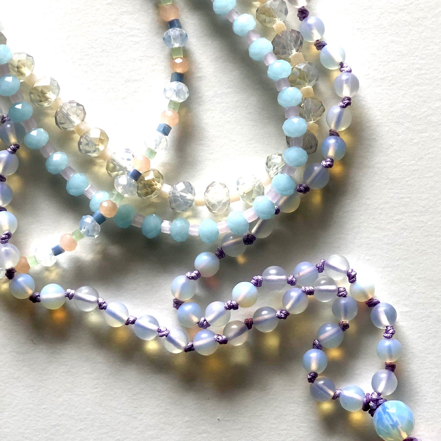 Violet Japamala and blue and white crystal necklace