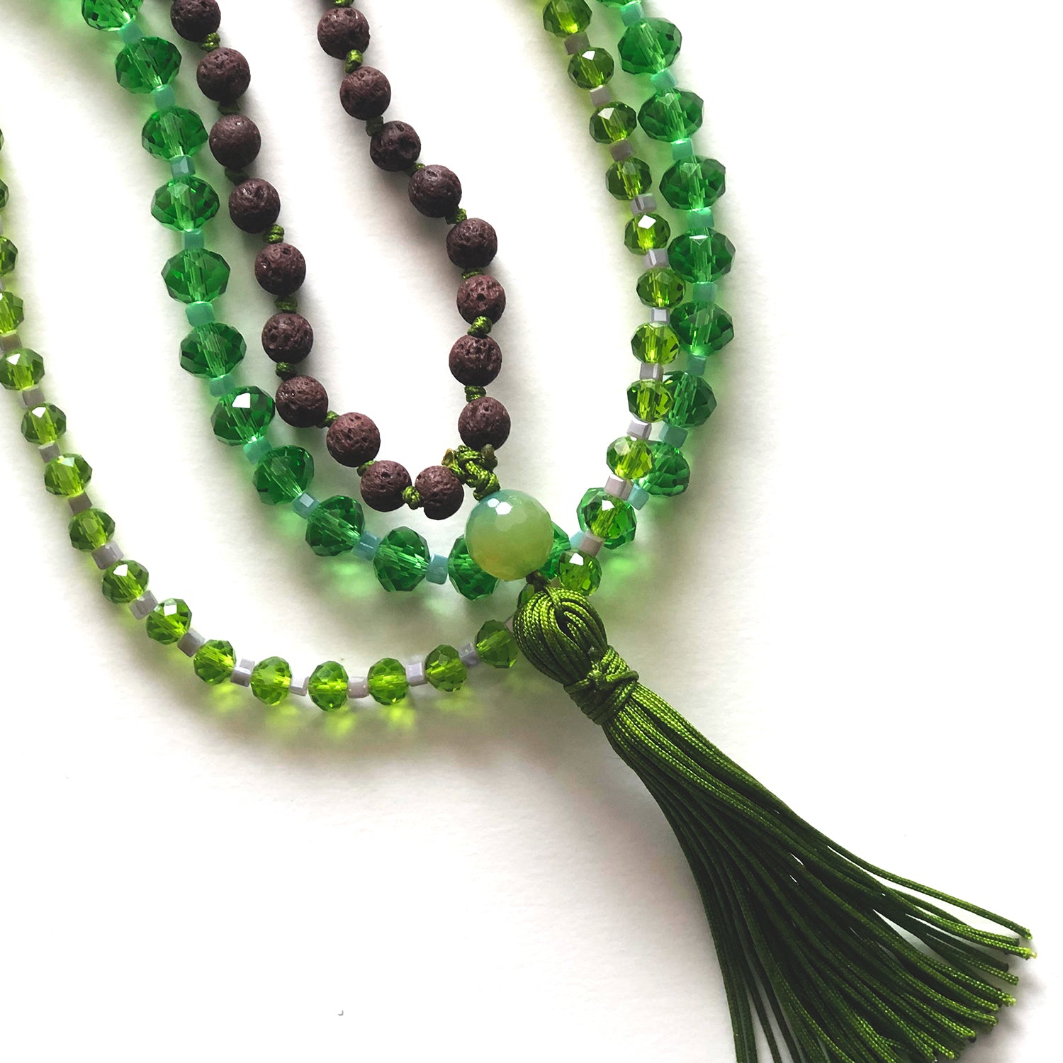 Brown japamala and green crystal necklaces