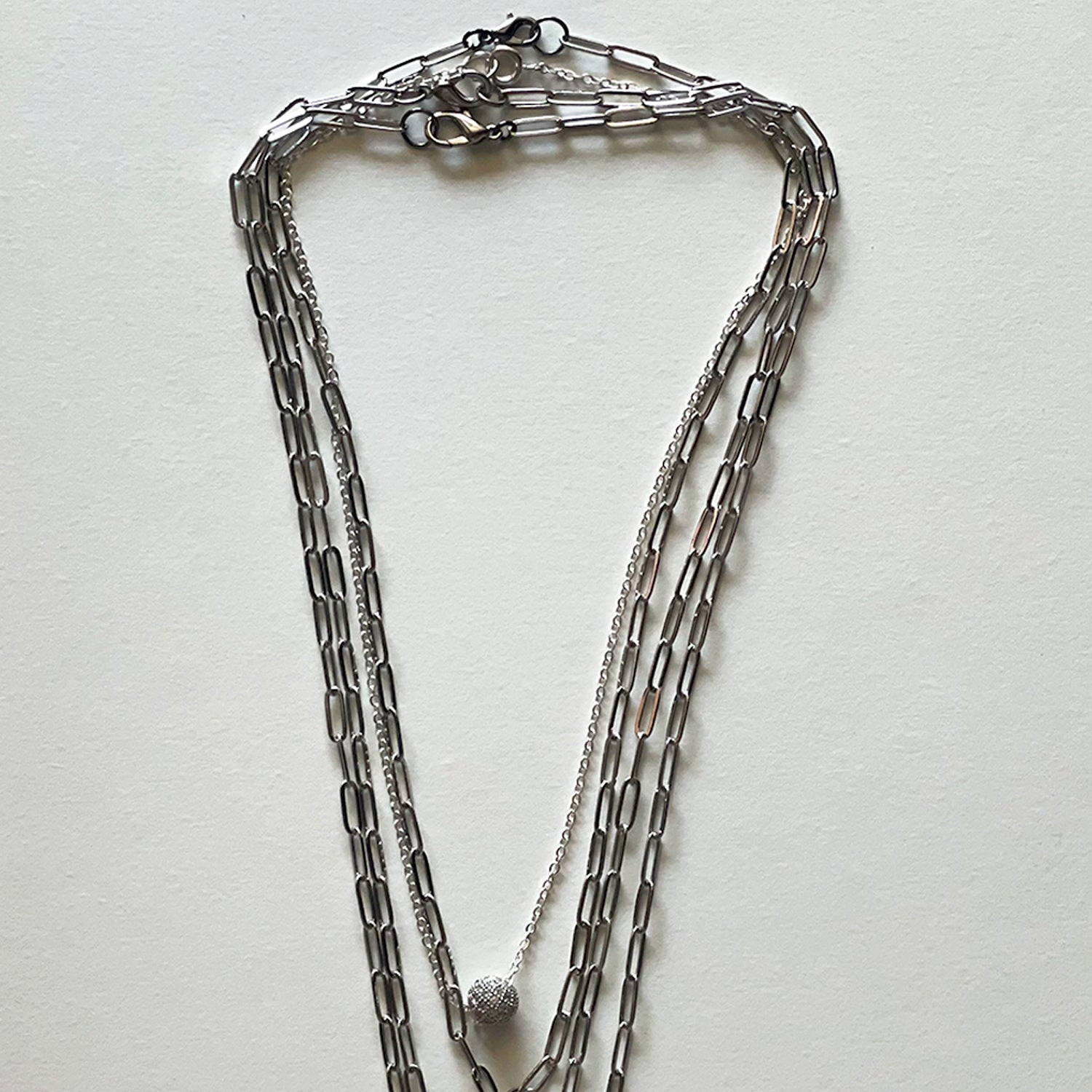 Saint Benedict and silver necklace