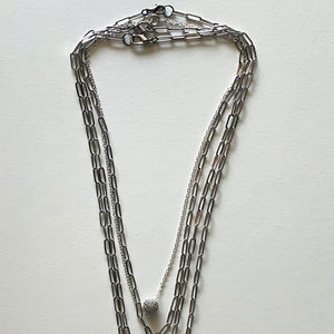Saint Benedict and silver necklace