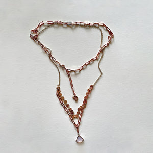 The white stone and rosa gold necklace